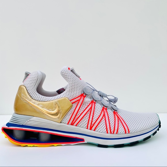 nike shox gravity vast grey metallic gold